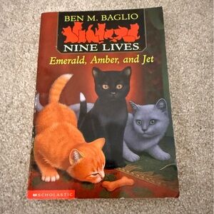 Scholastic Nine Lives Book with Orange, Black, and Gray Cats